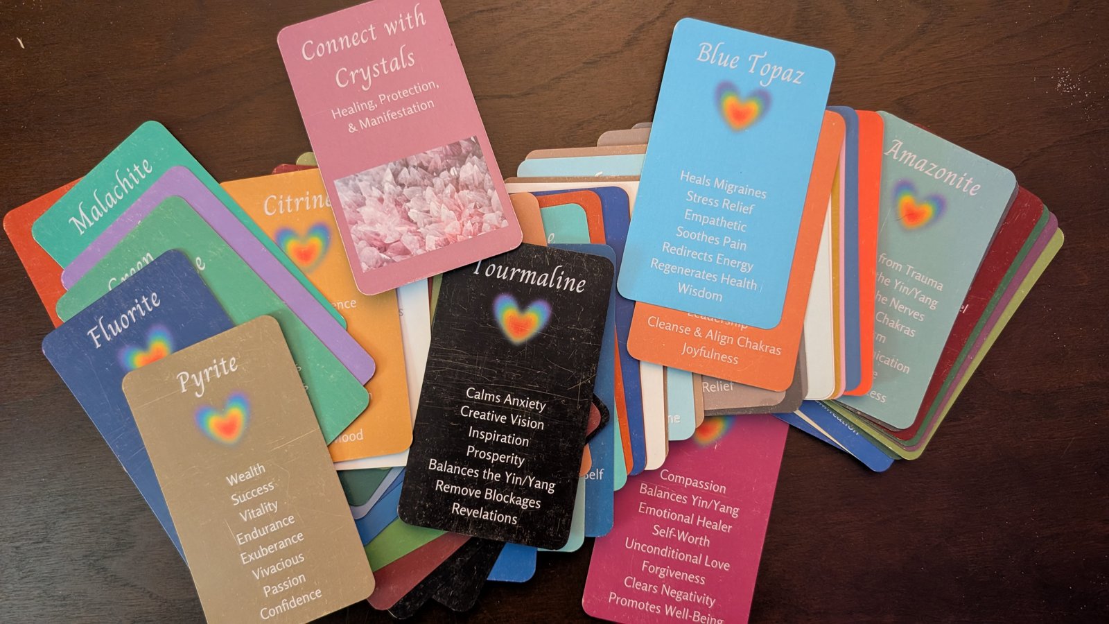 Colorful Connect with Crystals oracle cards spread on a table