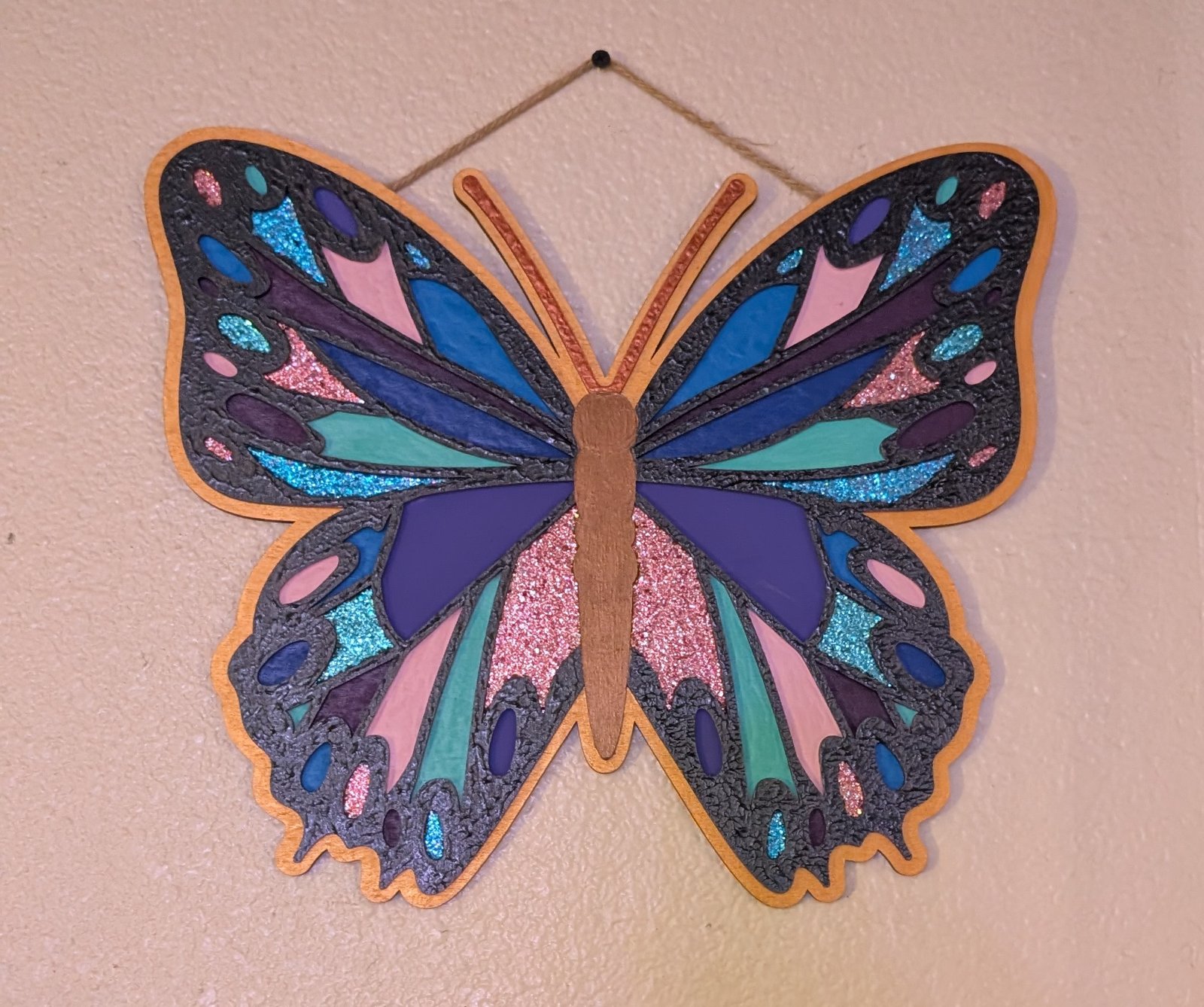 Hand-painted glitter butterfly in blue, pink and purple